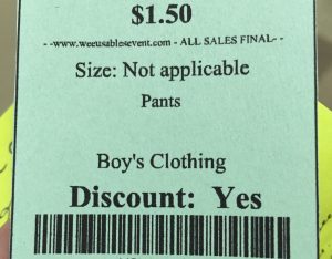 This green tag for boy trousers has no size listed, and the only word in the two-line description is "Pants."
